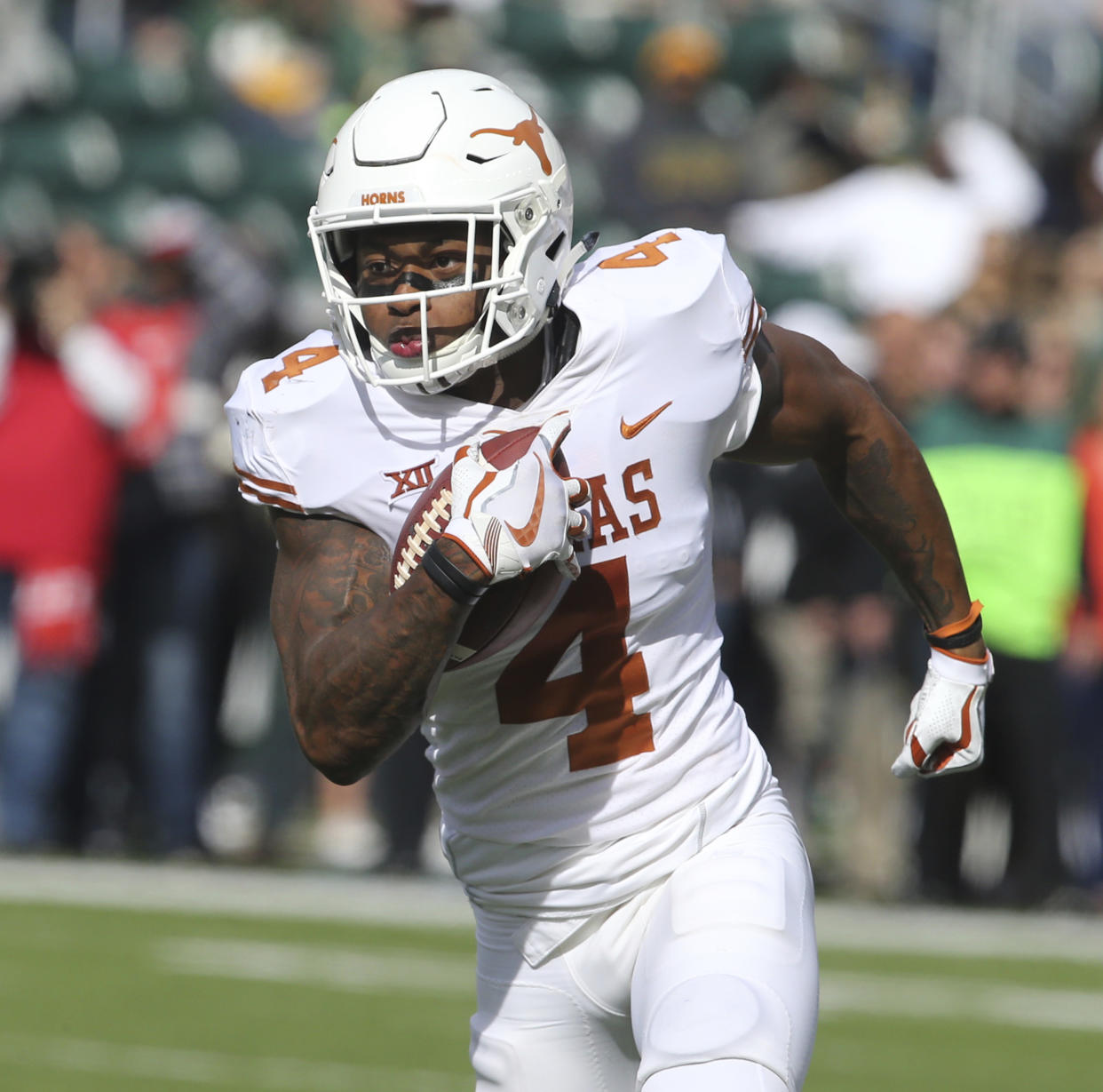 Texas safety DeShon Elliott returns an interception for a touchdown against Baylor in the first half of an NCAA college football game, Saturday, Oct. 28, 2017, in Waco, Texas. (AP Photo/Rod Aydelotte)