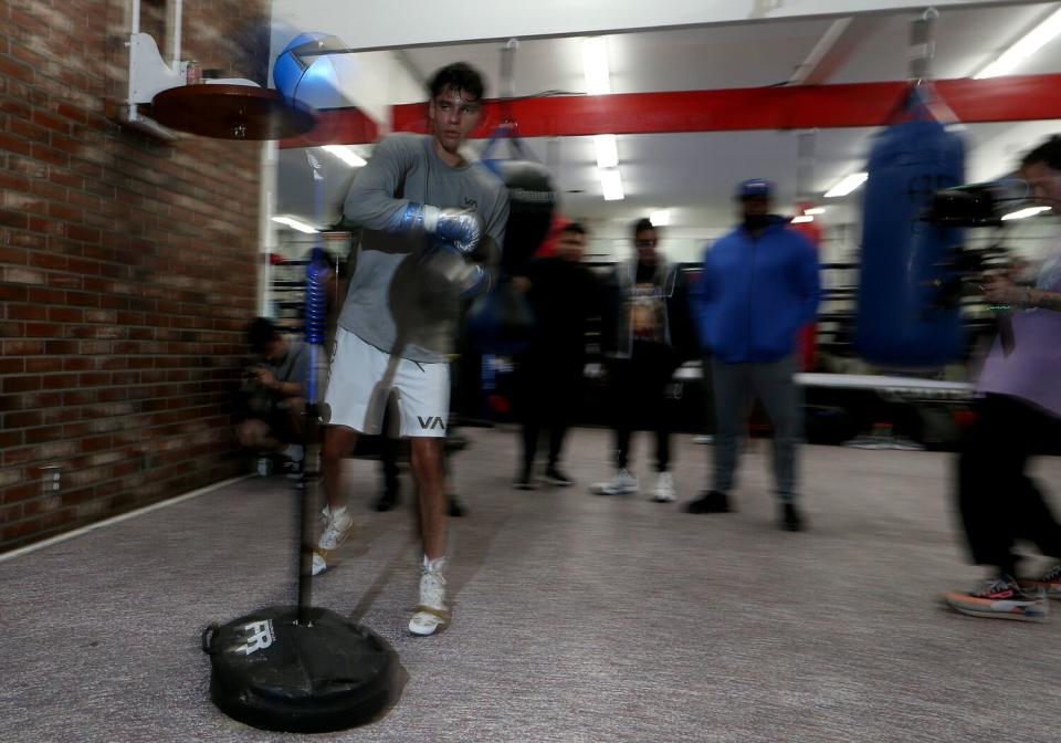 Ryan Garcia punches a reflex bag at Ten Goose Boxing Gym in Van Nuys as he prepares for his fight against Gervonta Davis