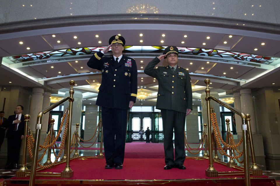 U.S. Army Chief of Staff Gen. Raymond Odierno, left, and Gen. Wang Ning, right, deputy Chief Staff of the People's Liberation Army (PLA), salute as they review an honor guard at China's Ministry of Defense in Beijing, Friday, Feb. 21, 2014. The U.S. Army chief met with top Chinese generals in Beijing Friday amid regional tensions and efforts to build trust between the two nation's militaries. (AP Photo/Alexander F. Yuan, Pool)