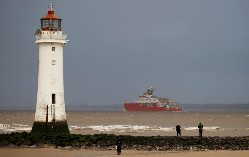 The RSS Sir David Attenborough sails past Perch Rock lighthouse as it leaves Liverpool to begin sea trials in New Brighton, Britain