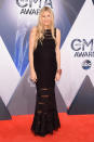 <p>The country singer (and granddaughter of the legendary Hank Williams) wore a black dress with sheer horizontal panels across the chest and legs. It’s a safe choice for Williams, who’s pregnant with her second child—but it’s hard to go wrong with a classic black dress.</p>