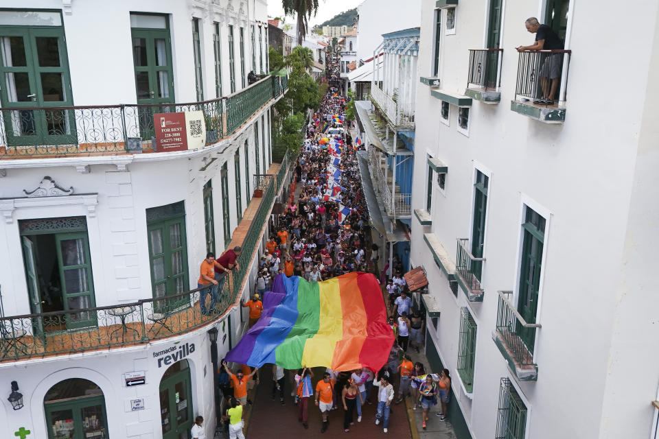 Revelers take part in a Gay Pride parade marking the culmination of LGBTQ+ Pride month, in Panama City, Saturday, June 29, 2024. (AP Photo/Matias Delacroix)