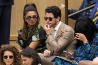 Priyanka Chopra Jonas and her husband Nick Jonas sit in the Royal Box ahead of the final of the women's singles between the Czech Republic's Marketa Vondrousova and Tunisia's Ons Jabeur on day thirteen of the Wimbledon tennis championships in London, Saturday, July 15, 2023. (AP Photo/Kirsty Wigglesworth)