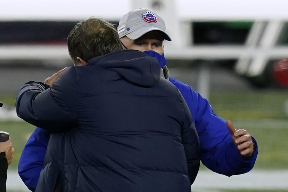 New England Patriots head coach Bill Belichick, front, embraces Buffalo Bills head coach Sean McDermott, rear, at midfield after an NFL football game, Monday, Dec. 28, 2020, in Foxborough, Mass. (AP Photo/Elise Amendola)