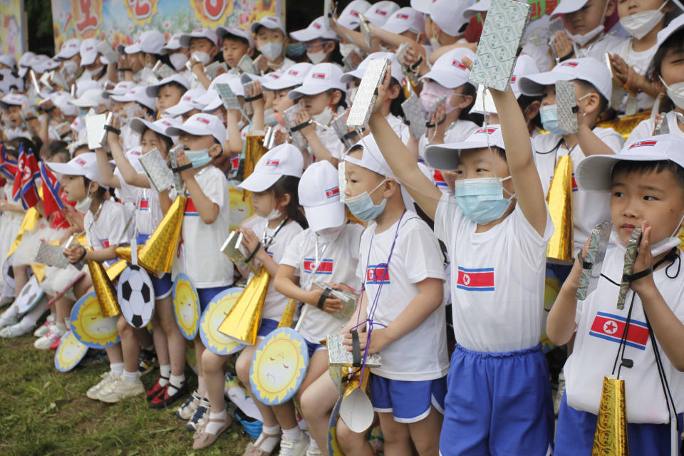 FILE - Children cheer during an event marking the 73rd anniversary of the International Children's Day at the Taesongsan Amusement Park in Pyongyang, North Korea on June 1, 2023. North Korean leader Kim Jong Un said it was a duty of women to stop a fall in the country’s births to strengthen national power, state media said Monday, Dec. 4, 2023, as his government steps up call for the people to have more children. (AP Photo/Cha Song Ho, File)