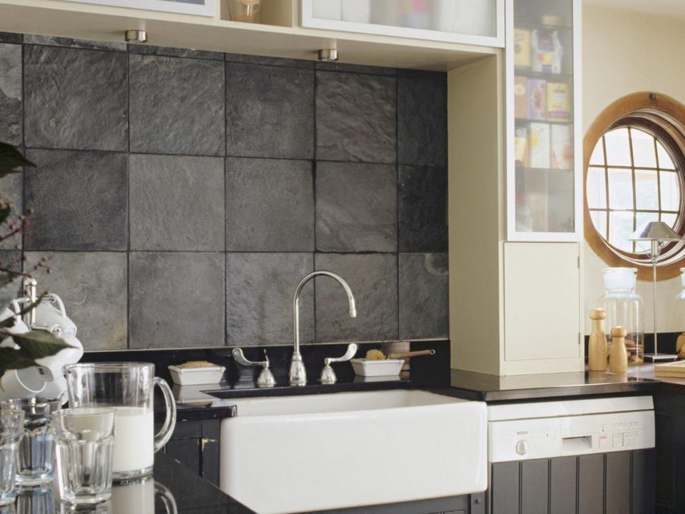 Kitchen with dark-gray stone backsplash