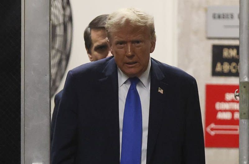 Former President Donald Trump returns to the courtroom from a recess during his criminal trial at Manhattan criminal court in New York on Thursday. Pool Photo by Brendan McDermid/UPI