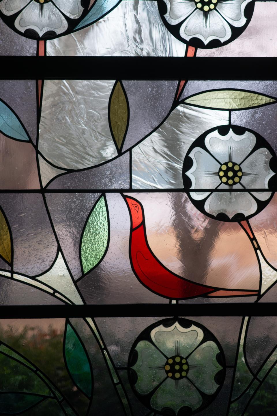 A stained-glass window inside the hallway leading to the sanctuary at Lowman United Methodist Church is known as the Narthex Window. It features art-deco styling from artist Robert Harmon, who designed and crafted the stained glass windows throughout the sanctuary.