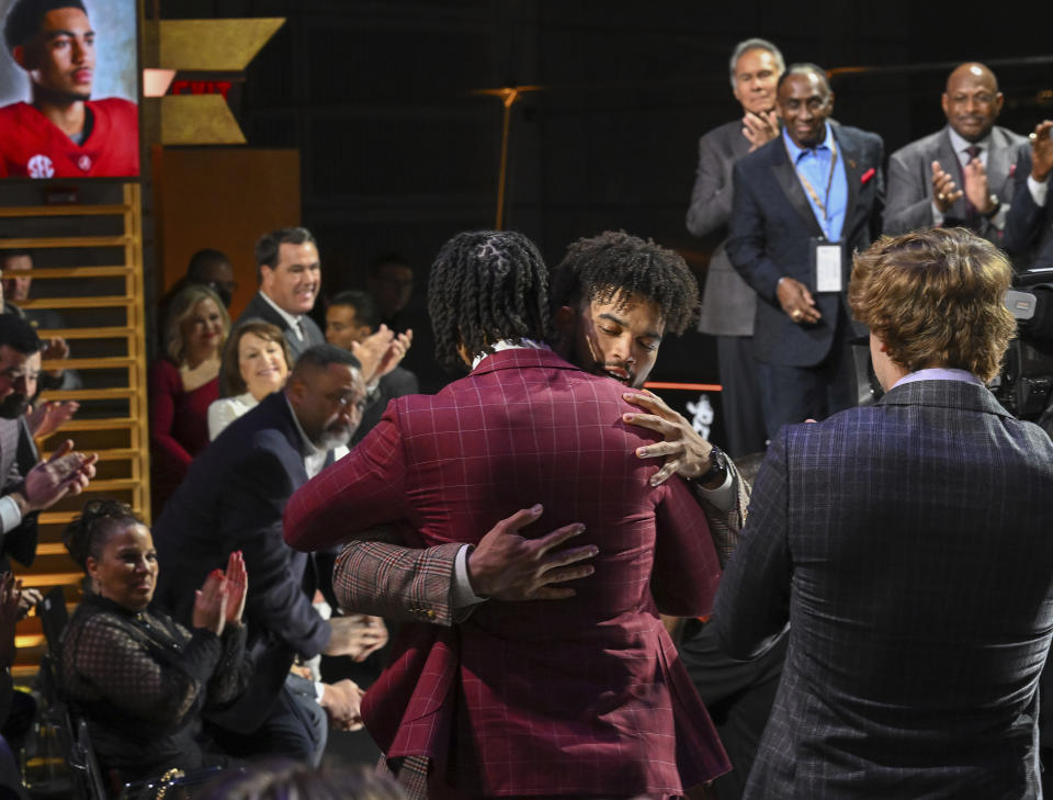 Caleb Williams, center right, reacts after winning the Heisman Trophy, Saturday, Dec. 10, 2022, in New York. (Todd Van Emst/Pool Photo via AP)