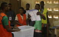 Electoral officials count ballot papers at the end of Presidential Election in one of the polling stations in Lome, Togo Saturday, Feb. 22 2020. The West African nation of Togo is voting Saturday in a presidential election that is likely to see the incumbent re-elected for a fourth term despite years of calls by the opposition for new leadership. (Photo/ Sunday Alamba)