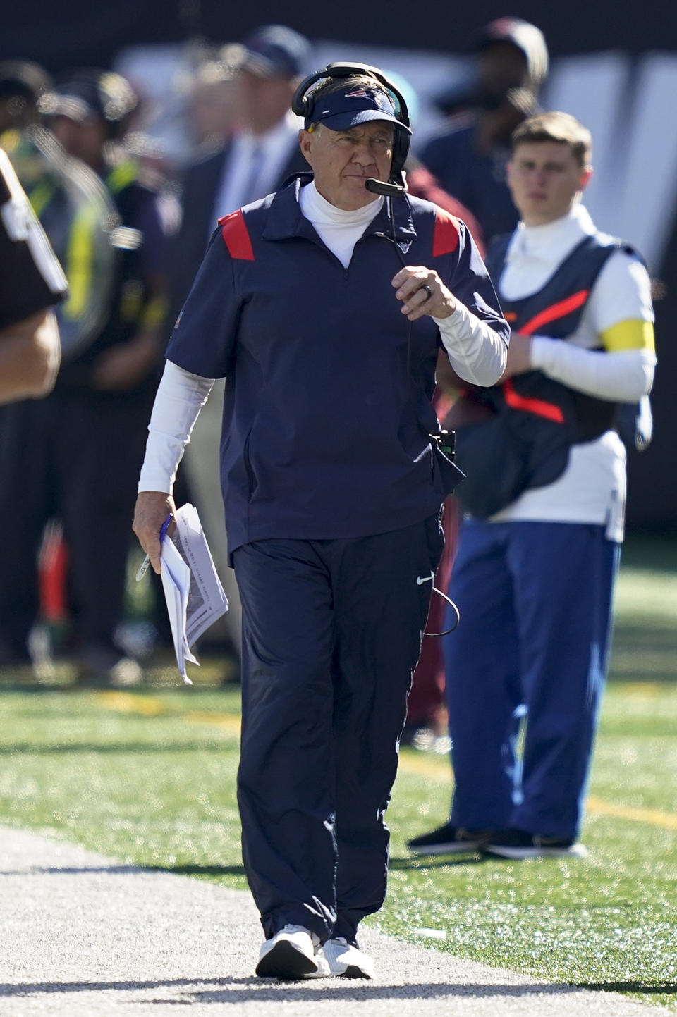 New England Patriots head coach Bill Belichick walks the sidelines during the second quarter of an NFL football game between the New York Jets and the New England Patriots, Sunday, Oct. 30, 2022, in New York. (AP Photo/John Minchillo)