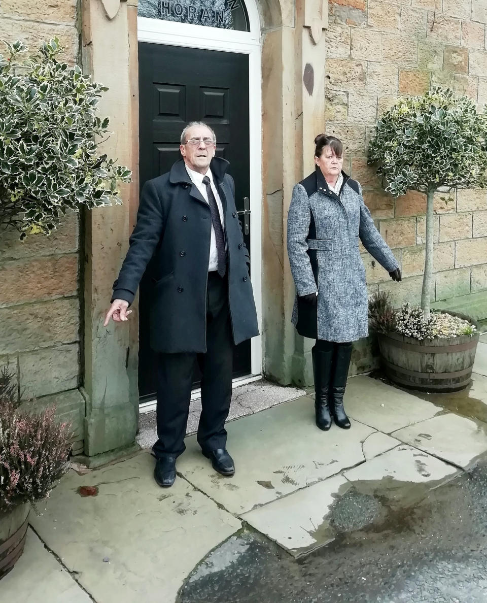 Ann Bentley & John Harpur outside the funeral home. (SWNS)