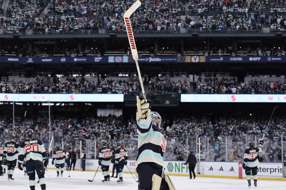 Seattle Kraken goaltender Joey Daccord circles the ice acknowledging the crowd after their win over the Vegas Golden Knights in an NHL Winter Classic hockey game, Monday, Jan. 1, 2024, in Seattle. (AP Photo/John Froschauer)