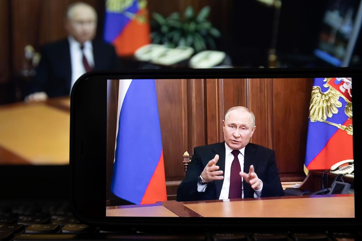 Photo taken on Feb. 21, 2022 shows a screen displaying Russian President Vladimir Putin speaking during a televised address to the nation in Moscow, Russia. Russian President Vladimir Putin announced on Monday that he has signed a decree recognizing 