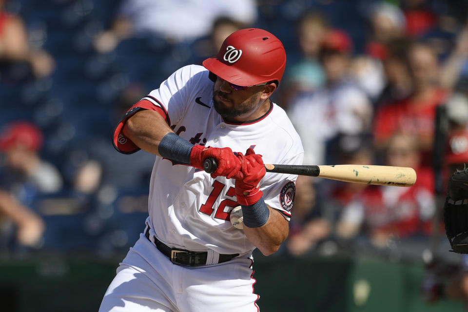 Washington Nationals' Kyle Schwarber gets hit by a pitch during the third inning of a baseball game against the Tampa Bay Rays, Wednesday, June 30, 2021, in Washington. (AP Photo/Nick Wass)