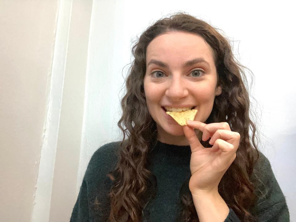 Insider reporter Talia Lakritz bites into a potato chip.