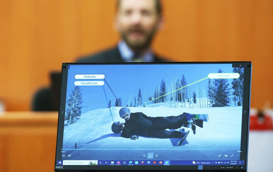 Dr Irving Scher shows an accident simulation during the trial - Reuters