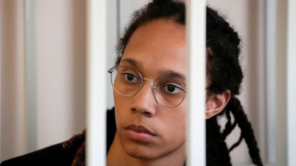 PHOTO: WNBA star and two-time Olympic gold medalist Brittney Griner sits in a cage at a court room prior to a hearing, in Khimki, Russia, July 27, 2022. (Alexander Zemlianichenko/Pool via Reuters)