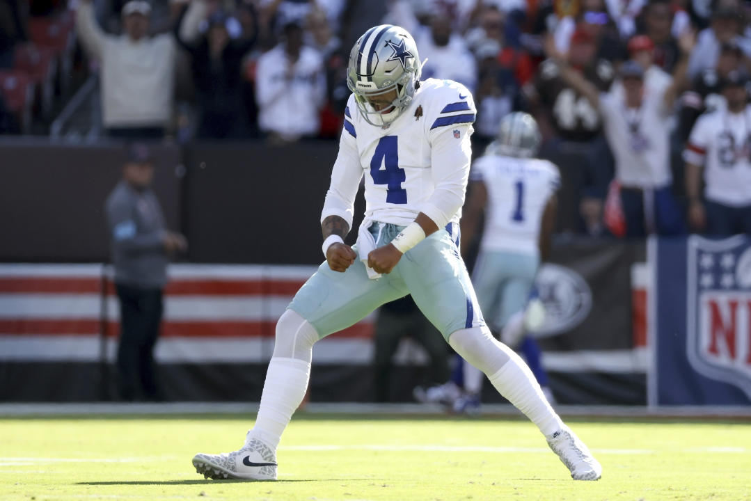 Dallas Cowboys quarterback Dak Prescott (4) reacts after throwing a touchdown pass during an NFL football game against the Cleveland Browns in Cleveland, Sunday, Sept. 8, 2024. (AP Photo/Kirk Irwin)