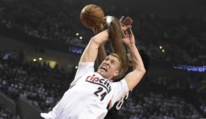 Mason Plumlee is a man of style and grace. (Steve Dykes/Getty Images)