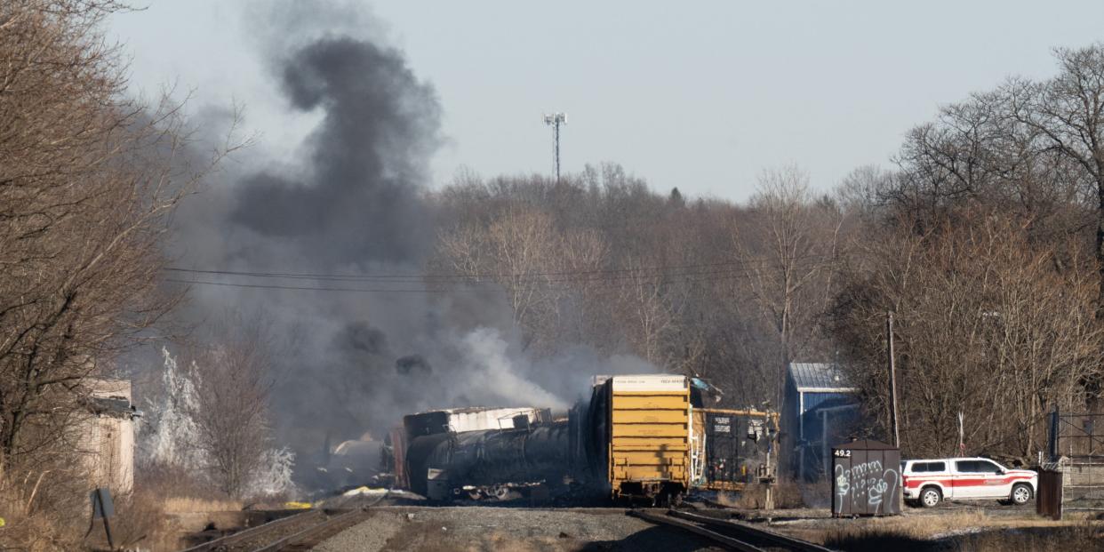 Smoke rises from a derailed cargo train in East Palestine, Ohio, on February 4, 2023. - The train accident sparked a massive fire and evacuation orders, officials and reports said Saturday. No injuries or fatalities were reported after the 50-car train came off the tracks late February 3 near the Ohio-Pennsylvania state border. The train was shipping cargo from Madison, Illinois, to Conway, Pennsylvania, when it derailed in East Palestine, Ohio. (Photo by DUSTIN FRANZ / AFP) (Photo by DUSTIN FRANZ/AFP via Getty Images)