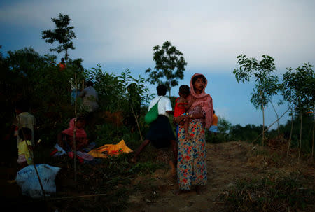 A Rohingya refugee woman looks on in a newly built makeshift camp, in Cox's Bazar, Bangladesh September 15, 2017. REUTERS/Mohammad Ponir Hossain