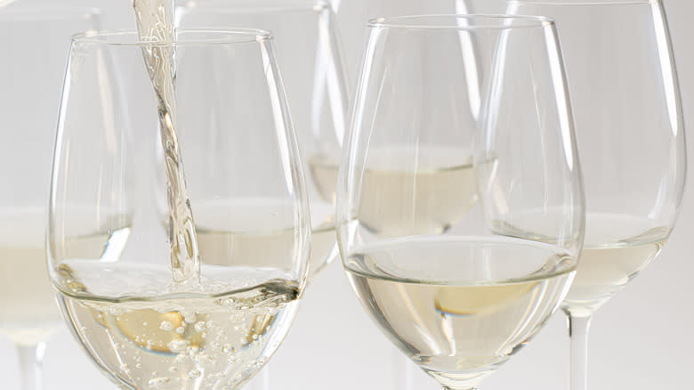 wine being poured into glasses