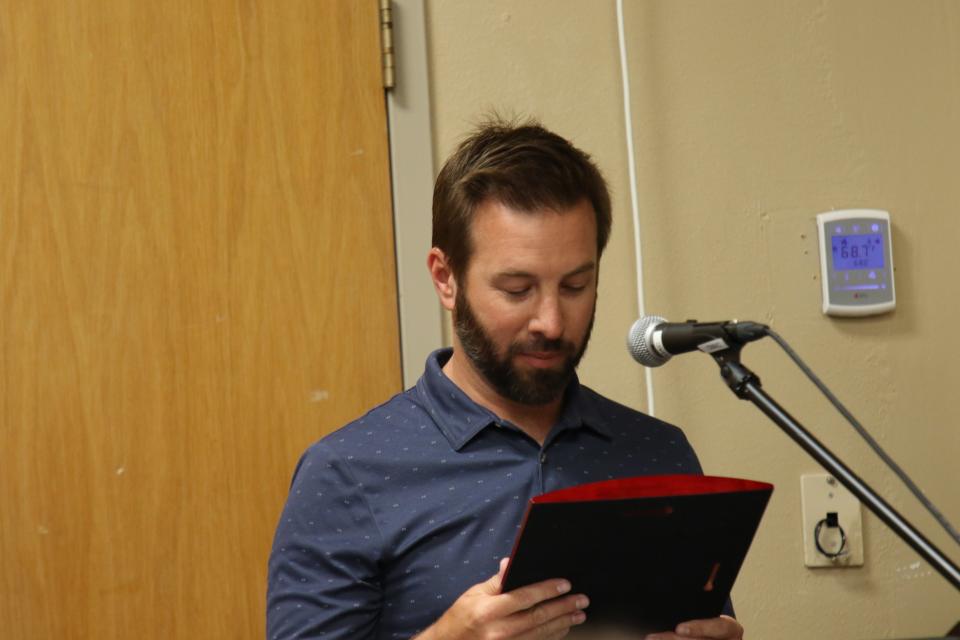 Carlsbad City Councilor Jeff Forrest reads a proclamation inducting his late Uncle Gary Forrest into the Carlsbad Hall of Fame on April 29, 2023.
