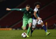 Britain Football Soccer - Scotland v Slovenia - 2018 World Cup Qualifying European Zone - Group F - Hampden Park, Glasgow, Scotland - 26/3/17 Slovenia's Josip Ilicic in action with Scotland's Ikechi Anya Reuters / Russell Cheyne Livepic