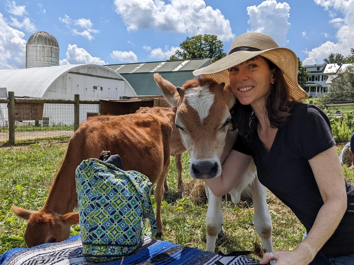 TJ Butler posing with cows