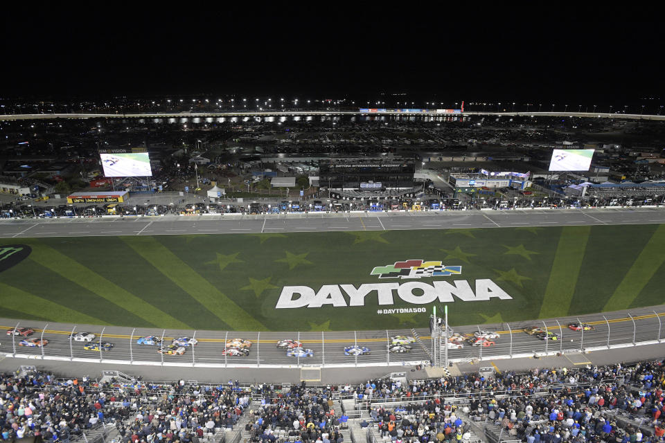 Drivers take the green flag on the start of the first of two qualifying races for the NASCAR Daytona 500 auto race at Daytona International Speedway Thursday, Feb. 14, 2019, in Daytona Beach, Fla. (AP Photo/Phelan M. Ebenhack)