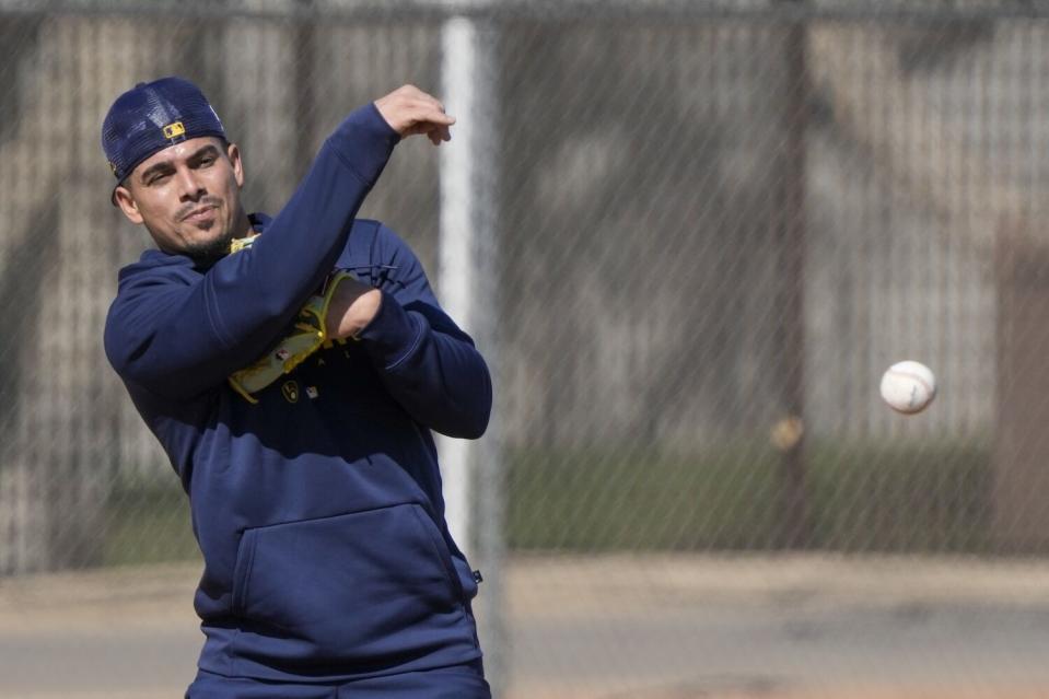 Milwaukee Brewers' Willy Adames thorws during a spring training workout on Feb. 16 in Phoenix.