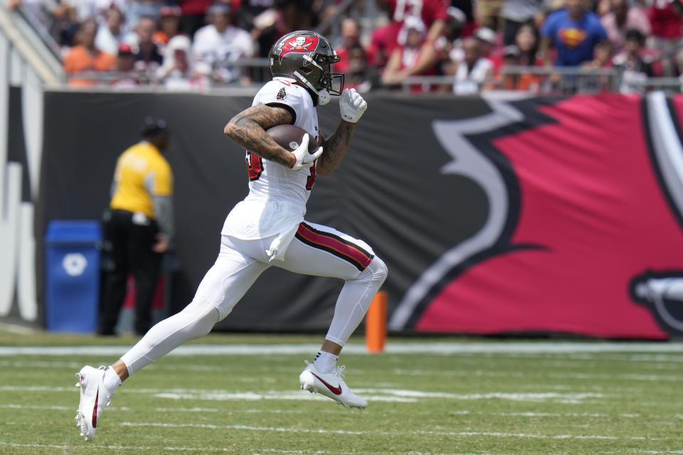 Tampa Bay Buccaneers wide receiver Mike Evans (13) runs after catching a pass for a 70-yard gain during the first half of an NFL football game against the Chicago Bears, Sunday, Sept. 17, 2023, in Tampa, Fla. (AP Photo/Chris O'Meara)