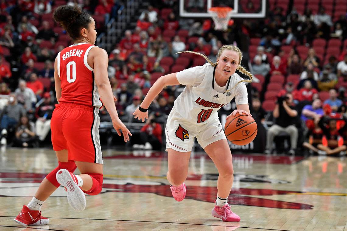 Louisville guard Hailey Van Lith (10) drives past Ohio State guard Madison Greene (0) during the second half of an NCAA college basketball game in Louisville, Ky., Wednesday, Nov. 30, 2022. Ohio State won 96-77. (AP Photo/Timothy D. Easley)
