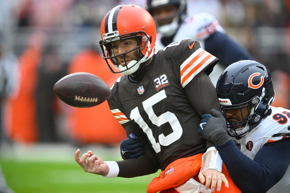 Chicago Bears defensive end Montez Sweat (98) forces a fumble against Cleveland Browns quarterback Joe Flacco (15) in the first half of an NFL football game in Cleveland, Sunday, Dec. 17, 2023. (AP Photo/David Richard)