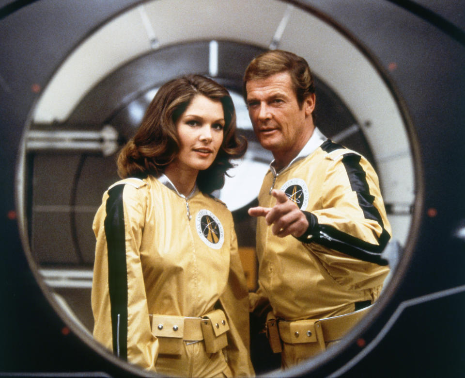 Actor Roger Moore and actress Lois Chiles on the set of 