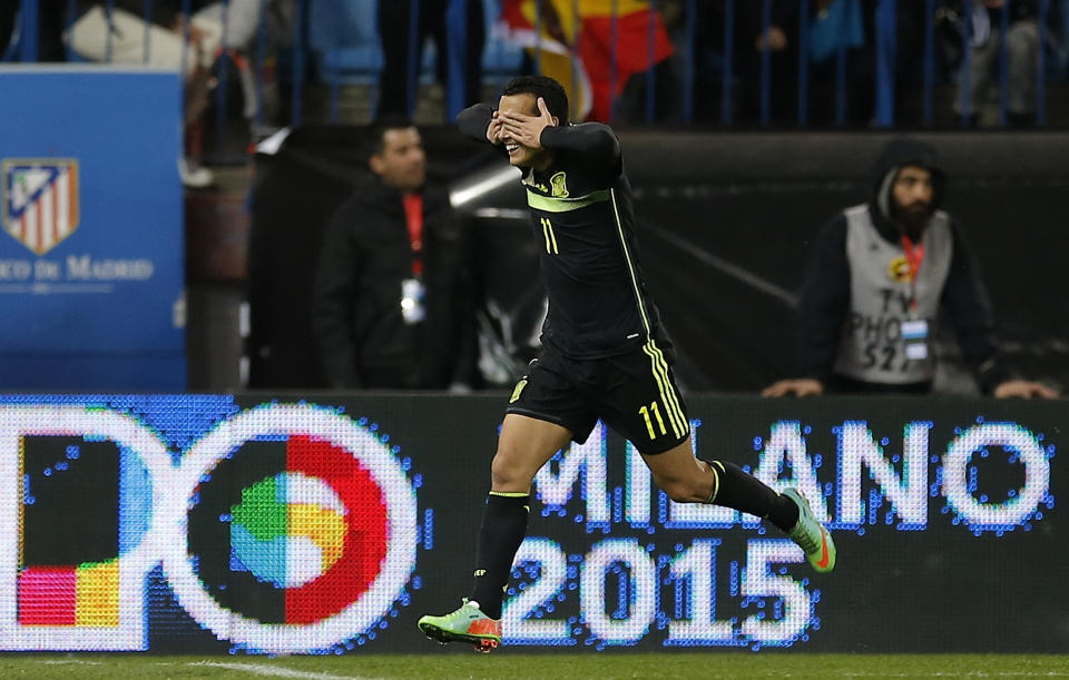 Spain's Pedro Rodriguez celebrates after scoring against Italy during a friendly soccer match at the Vicente Calderon stadium in Madrid, Wednesday March 5, 2014. (AP Photo/Paul White)