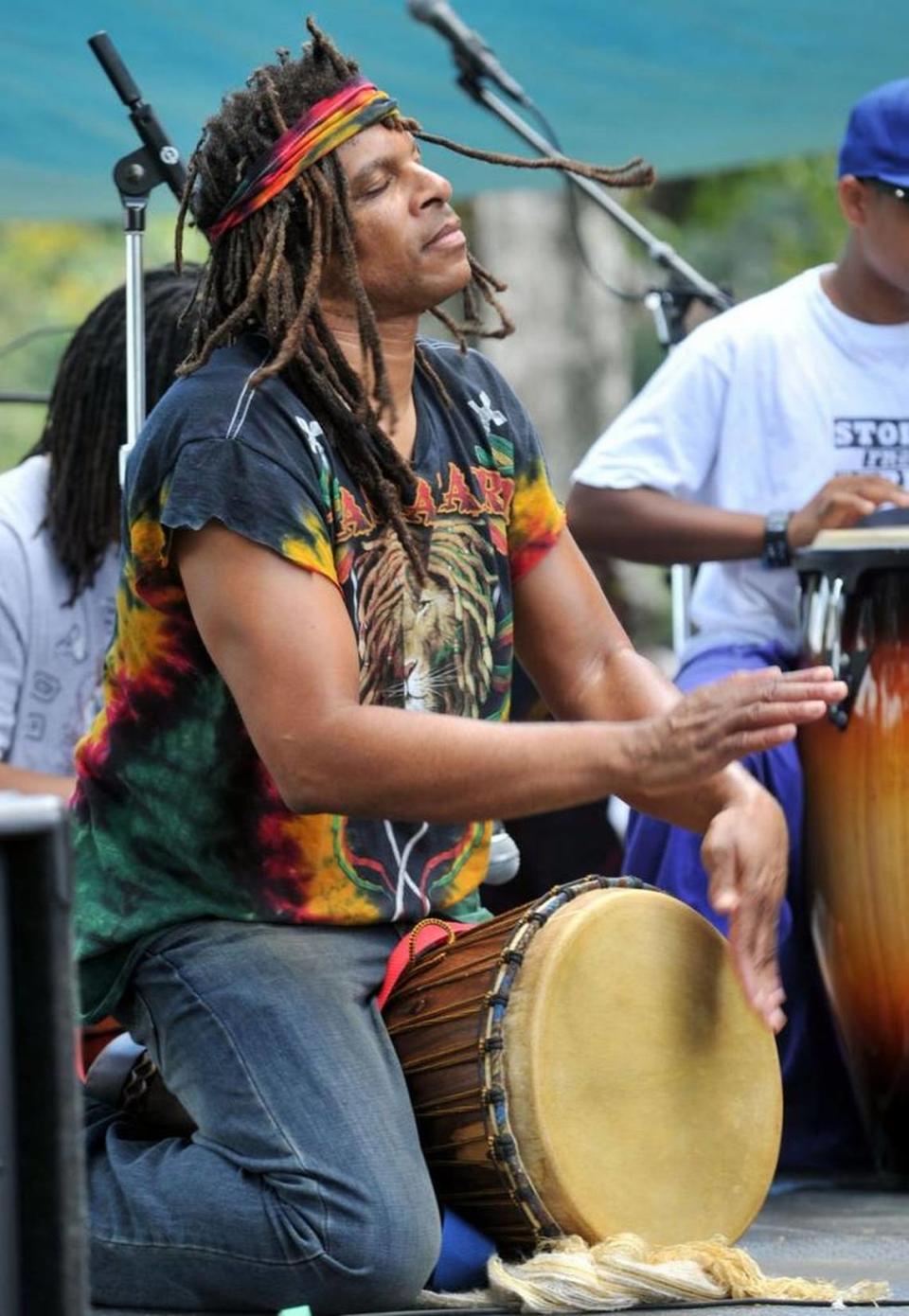 Dean Brown performs with a drum band during a previous year’s Juneteenth Festival at Tattnall Square Park.