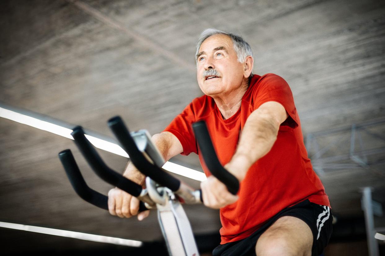 Senior man on a stationary bike