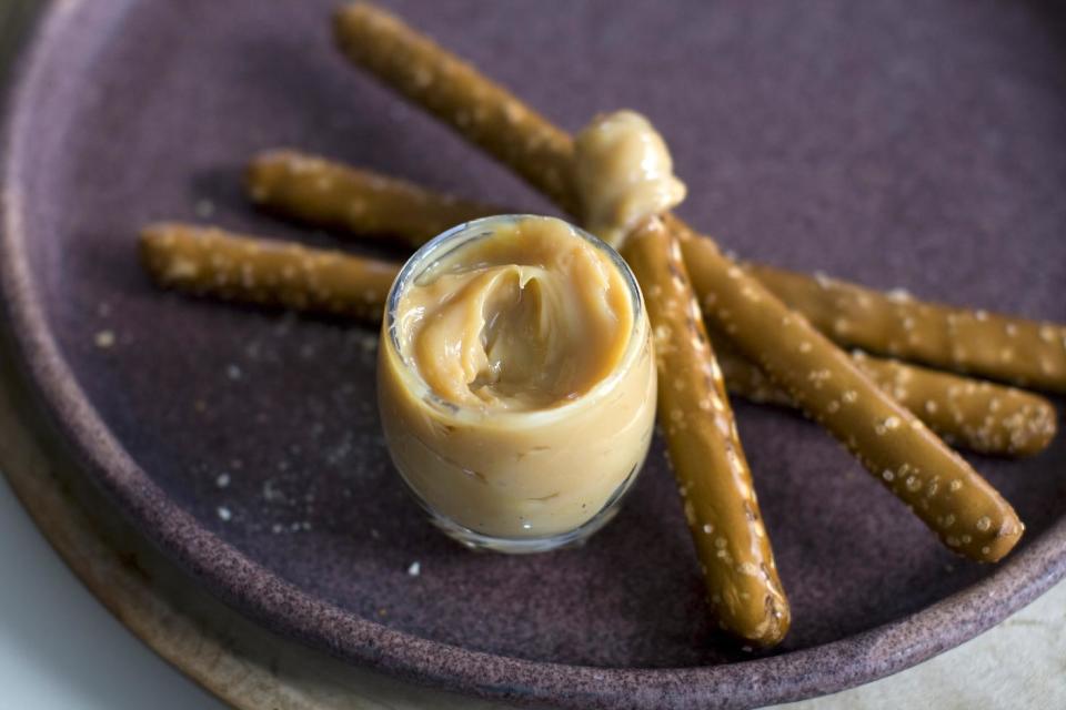 This April 1, 2013 photo taken in Concord, N.H. shows pretzel sticks with a dulce de leche spread. (AP Photo/Matthew Mead)