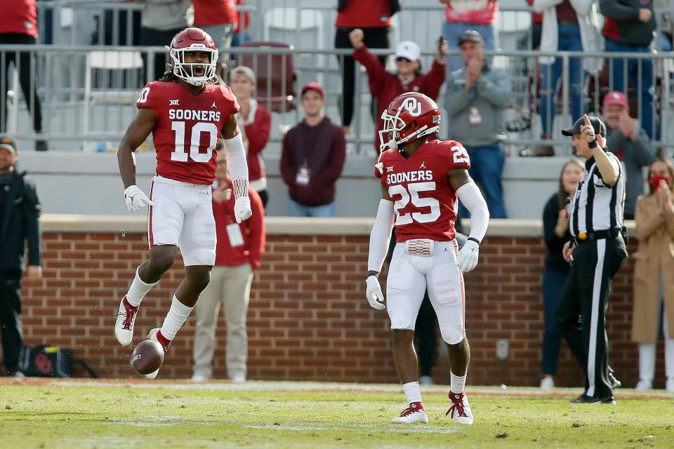 Justin Broiles (25) celebrates an interception with former Sooner Pat Fields last season against Iowa State. Broiles was named one of OU's captains for this season's opener on Saturday against UTEP.