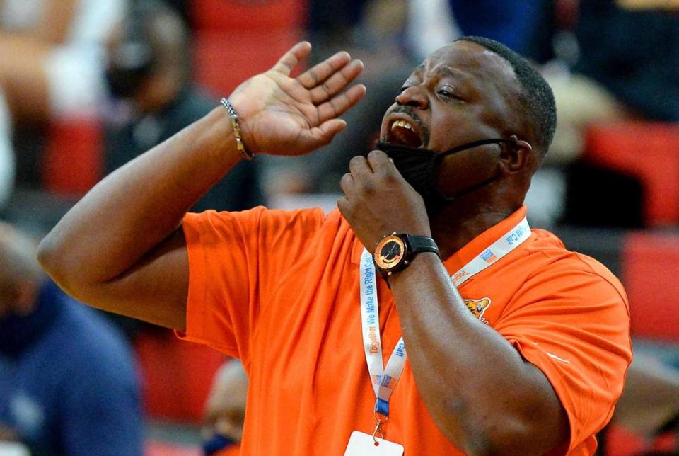 Vance Cougars head coach Donnell Rhyne yells instructions to his team during second half action of the 4A State Championship against Garner at Wheatmore High School in Trinity, NC on Saturday, March 6, 2021. Vance defeated Garner 74-38.