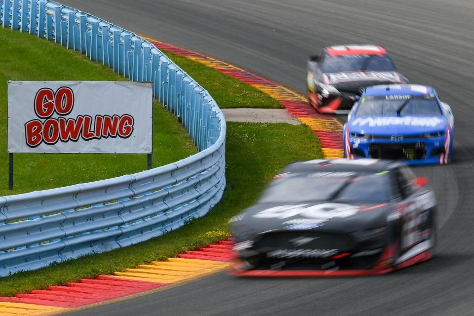 Joey Logano leads Kyle Larson and Martin Truex Jr. during the 2021 Go Bowling at The Glen race at Watkins Glen International.