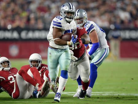 Sep 25, 2017; Glendale, AZ, USA; Dallas Cowboys running back Ezekiel Elliott (21) runs with the ball against the Arizona Cardinals during the second half at University of Phoenix Stadium. Mandatory Credit: Joe Camporeale-USA TODAY Sports