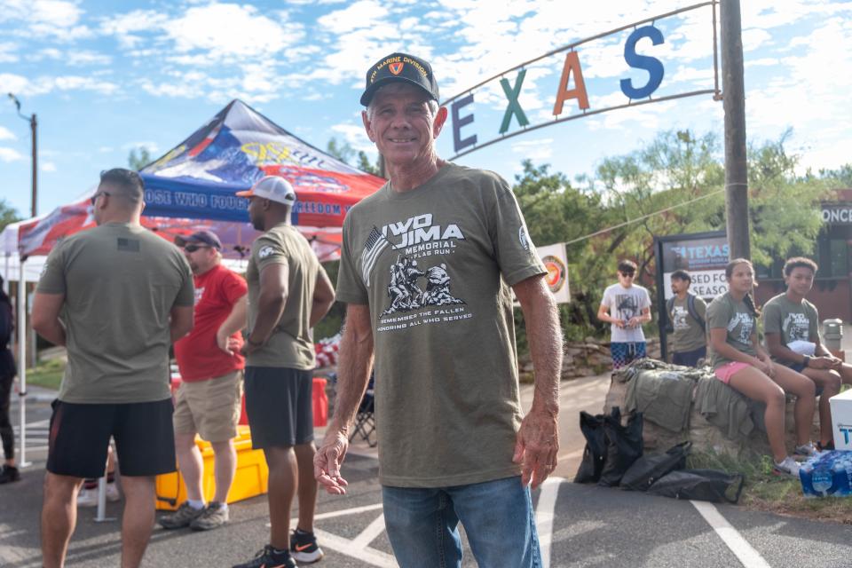 Organizer Johnny Cobb gets teams organized Saturday morning at the Iwo Jima Flag Run at Palo Duro Canyon.