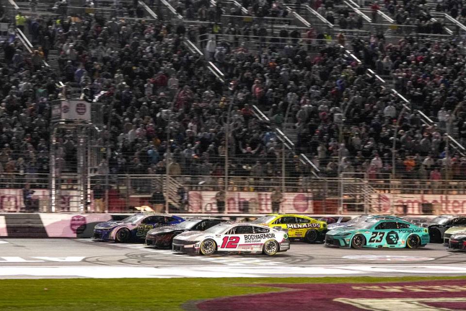 Daniel Suarez (99) (near wall) beats Ryan Blaney (12) to the finish line to win the Ambetter Health 400 at Atlanta Motor Speedway.