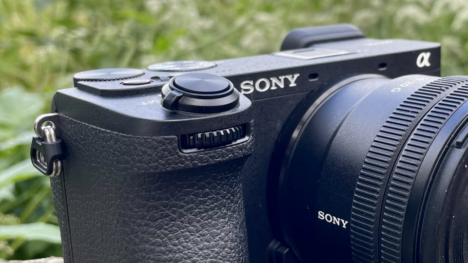 Sony Alpha A6700 mirrorless camera outside on a wall