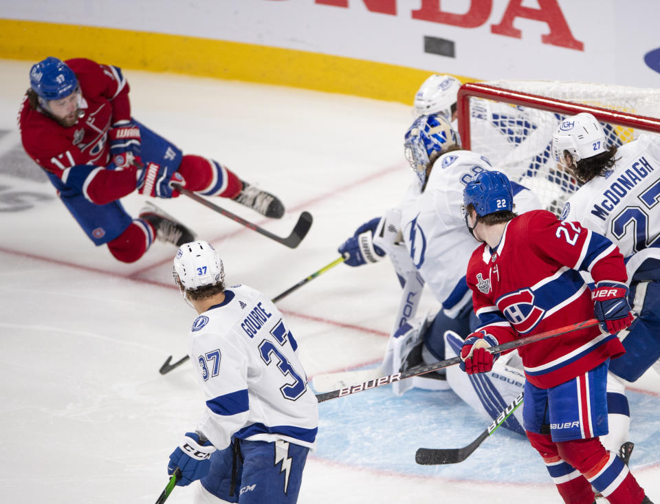 Montreal Canadiens' Josh Anderson (17) scores the winning goal against Tampa Bay Lightning's goaltender Andrei Vasilevskiy (88) during overtime of Game 4 of the NHL hockey Stanley Cup final in Montreal, Monday, July 5, 2021. (Ryan Remiorz/The Canadian Press via AP)