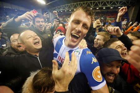 Soccer Football - FA Cup Fifth Round - Wigan Athletic vs Manchester City - DW Stadium, Wigan, Britain - February 19, 2018 Wigan Athletic’s Dan Burn celebrates with fans on the pitch after the match Action Images via Reuters/Carl Recine