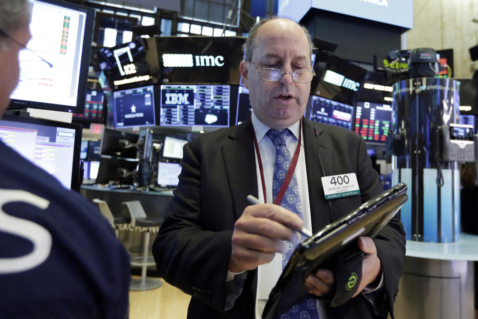 Trader Gordon Charlop works on the floor of the New York Stock Exchange, Monday, July 30, 2018. Stocks are off to a mixed start on Wall Street as gains in banks and energy companies are offset by losses in other sectors. (AP Photo/Richard Drew)